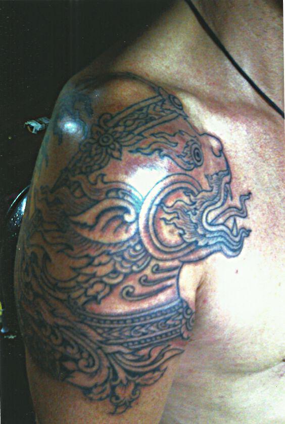 Thai Buddhist Face on Shoulder